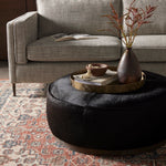 Sinclair Large Round Ottoman Black Hair on Hide Staged View Four Hands