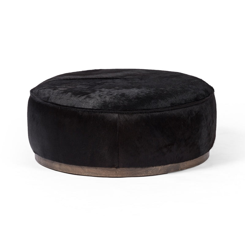 Sinclair Large Round Ottoman Black Hair on Hide Angled View 106119-014