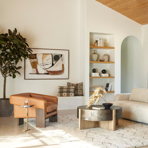 Cairo Chair Palermo Cognac angled view on a rug in a furnished room