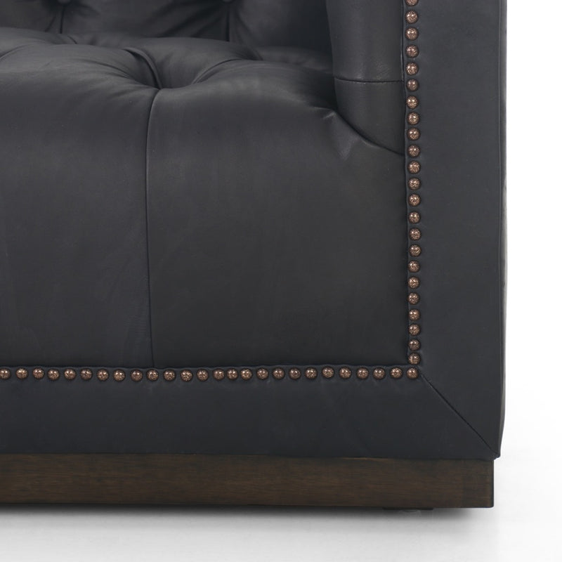 Maxx Sofa - Heirloom Black up close view bottom right front bronze nailheads