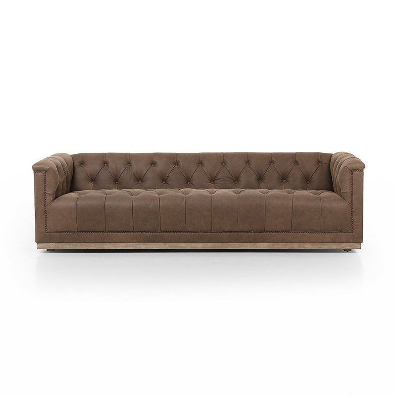 tufted brown leather sofa